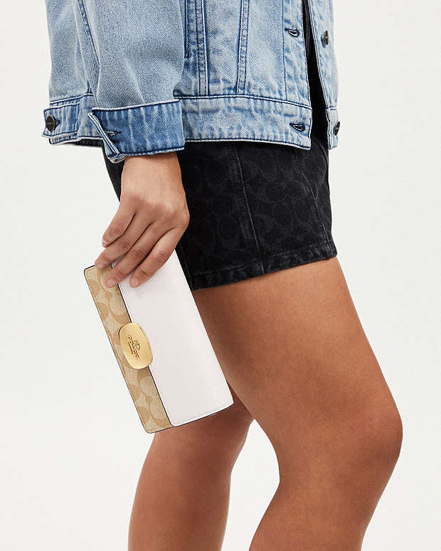 Eliza Small Flap Crossbody In Signature Canvas Coach