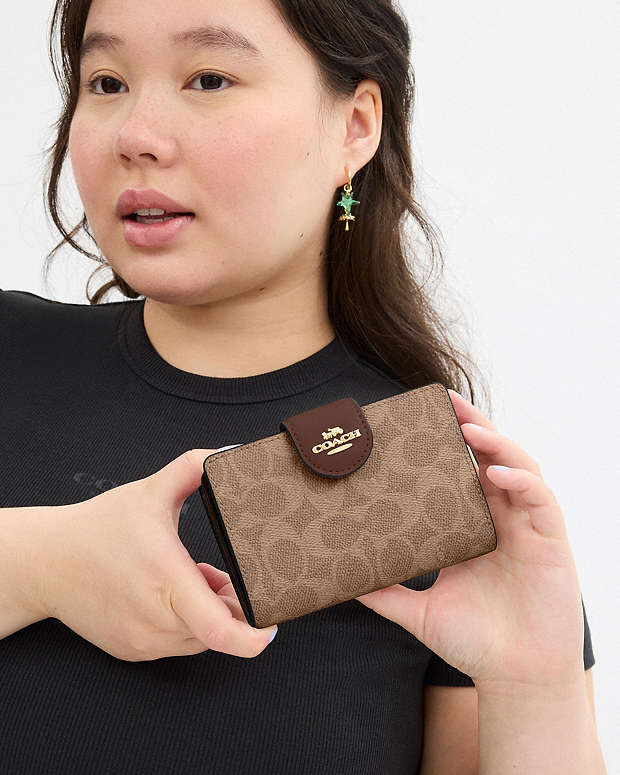 Coach Medium Corner Zip Wallet In Signature Canvas in tan brown