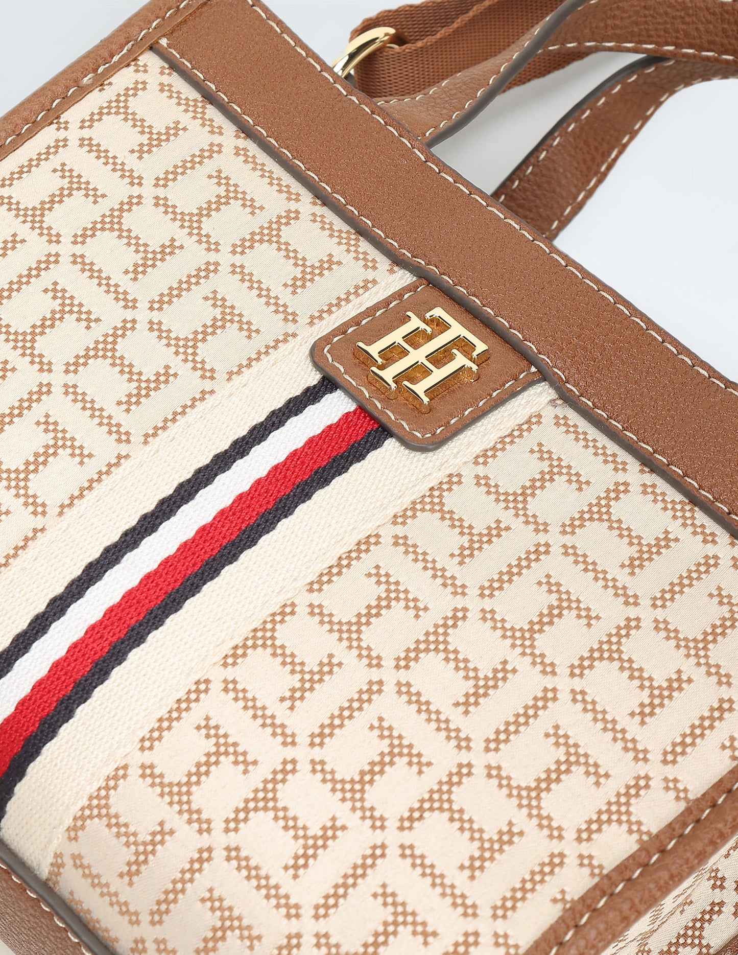 Tommy Hilfiger Brand Logo Textured Handheld Bag in beige