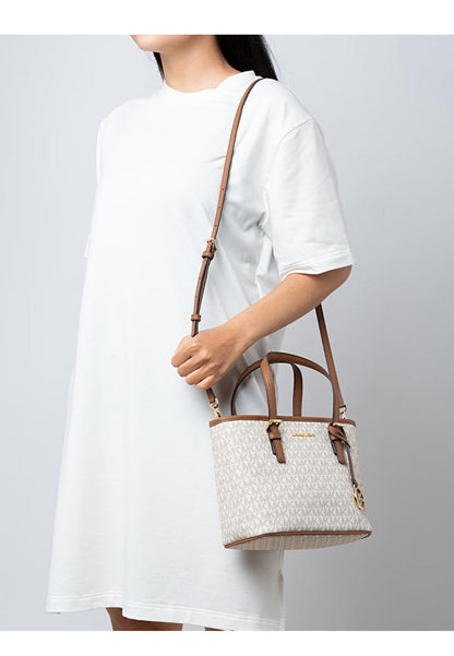 Micheal Kors small Jet Set Travel tote bag with top zip closure and logo in white