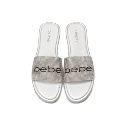 Bebe Rhinestone Logo Slide Sandals In White/Silver