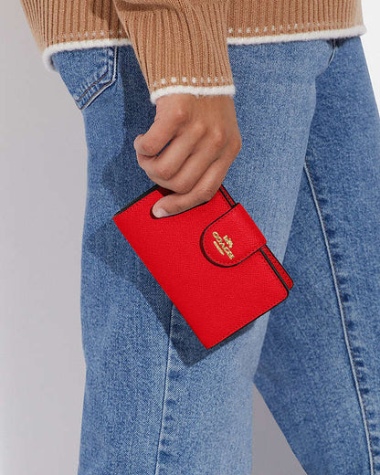 Coach Medium Corner Zip Wallet in Bright Poppy in gold accessories
