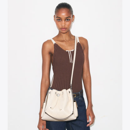 TORY BURCH CHARLIE QUILTED DRAWSTRING SHOULDER BAG IN WHITE