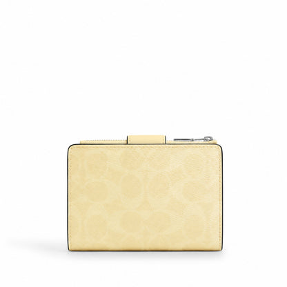 Coach Medium Corner Zip Wallet in Pale Yellow Signature Canvas